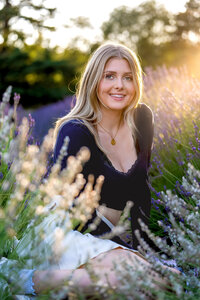 Senior high school girl in a lavender field at golden hour