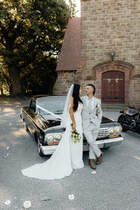 Newlyweds with their classic car during a Christchurch wedding