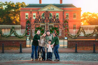 Family hugging together in front of historic Tryon Palace in New Bern North Carolina