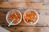 a close up photo of the bride and grooms dutch bros drinks