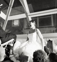 High-energy documentary wedding photography capturing the Horah dance under a clear-top tent at Chatham Bars Inn.
