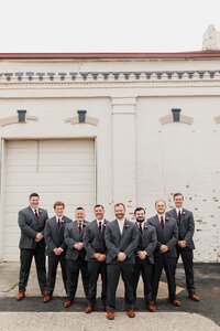 Groomsmen portraits at The Refinery, a top wedding venue near Louisville with industrial exterior