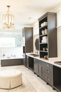 Charcoal cabinets in master bathroom renovation by Moda Designs