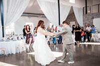 Bride and Groom sharing their first dance at The Barn At Paradise Place captured by Graceful Ray Photography in Fort Worth Texas