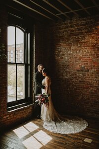wedding couple in the penthouse at Partic O'sheas one of louisvile's best wedding venues
