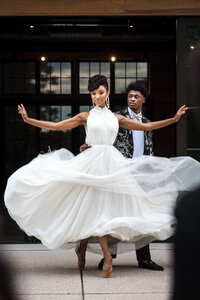 Black-bride-and-groom-ballet-dancers-twirling-the-bride-capturing-her-dress-flowing-at-North-Corner-Haven
