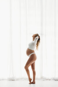 Charleston Maternity Photographer - Pregnant woman poses for Fine Art, Editorial Maternity Portraits at Holy City Babies Portrait Studio in Charleston, SC.