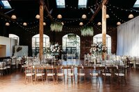 Best Louisville Kentucky wedding venue near Louisville with reception tables and hanging greenery at The Refinery South