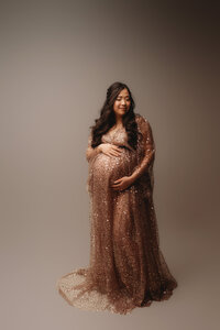 Expectant mother poses for Studio Maternity Photoshoot in Charleston, SC