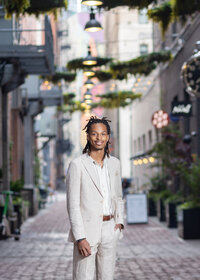 Boy taking senior photos in Downtown Detroit by Savvy Shoots Photography