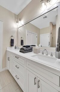 Master bathroom with dual sinks  in this 3-bedroom, 2-bathroom vacation rental home near the Silos and Baylor in Waco, TX