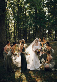 Bride and bridesmaids with warm-toned bouquets by Flowergirl Cville at Keswick Vineyard, Charlottesville area wedding venue | Photo by Abby Hart Photography