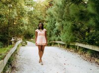 Senior portrait at Bella Sera Gardens in Loxley, Alabama — full-body pose in front of limelight
hydrangeas.