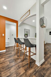 Bar height seating for three at this three-bedroom, two-bathroom vacation rental house just 5 minutes from The Silos in downtown Waco, TX.
