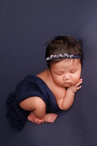 Custom newborn photography session in Elk Grove with organic textures and soft neutral palette designed before baby’s arrival