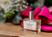 Wedding detail shot with brides shoes and perfume