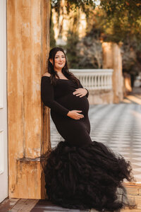 Maternity Photos in Charleston, SC -- Expectant mother poses for Maternity Portraits in downtown Charleston, SC.