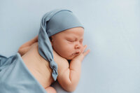 Newborn Pictures in Charleston - Infant posed for Newborn Pictures during Newborn Photoshoot at Holy City Babies Newborn Photography Studio in Charleston, SC.