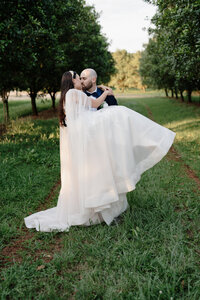 bride and groom under the brides veil at gabbinbar homestead