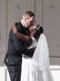 Traditional first kiss at the end of the ceremony. Classic wedding in Half Moon Bay, California