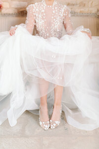 bride with bridal shoes