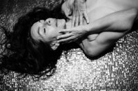 Boudoir experience whilst traveling lying on golden tiled floor
