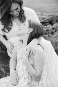 black and white photo of mom with hand around daughter's shoulder