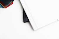 Close-up of luxury photo album corner with fabric swatches in various colors, Kaitlyn Dawn Photography, Yucaipa newborn and family photographer.