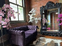 the purple velvet couch in Elevation boudoir's studio
