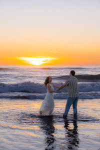 couple dancing in ocean in santa cruz california