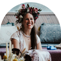 smiling human wearing a flower crown