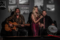 A band on a small stage playing together