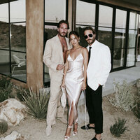 superherodesignco_34572_Bride_and_groom_standing_outside_a_mi_e1ce05ad-0bd0-4517-8aa6-36248dd2360f_2
