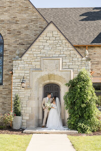Bride and Groom in doorway of Venue3Two wedding venue in Grand Rapids Michigan wedding photography