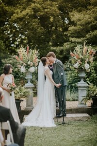 Bride and groom during ceremony at Yew Dell Botanical Gardens