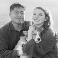 fun couple with corgi on cliffside in san francisco at battery spencer
