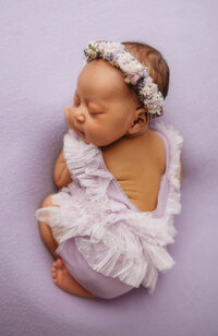 Infant posed for Newborn Baby Photos at Holy City Babies Portrait Studio in Charleston, SC.