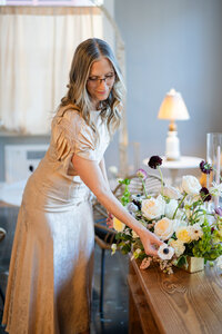 Owner of Flowergirl Cville and Maison Charlottesville designing a centerpiece - photo by Jo Mahoney