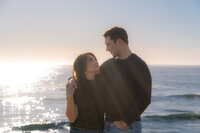 Sunset ocean couple engagement photos on santa cruz cliffside
