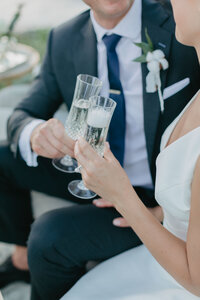 wedding couple cheers champagne glasses