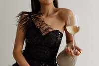 kaboompics_classy-aesthetics-beautiful-asian-woman-in-black-evening-dress-white-wine-in-a-glass-29551