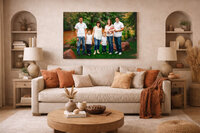 Large acrylic family portrait displayed above a neutral sofa in a warm earthy living room in New Bern North Carolina
