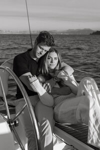 couple cuddling on a sailboat
