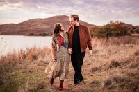 Artistic engagement portrait of a couple walking taken by Graceful Ray Photography in Dallas-Fort Worth.