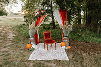 gravel-and-grace-outdoor-curtain-arch-velvet-chair.jpg