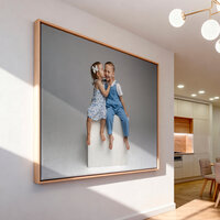 Framed wall art of two young children sharing a sweet moment displayed in a modern home, Kaitlyn Dawn Photography, Yucaipa family photographer.