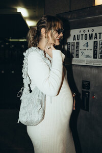 Artistic motherhood portrait of a mom-to-be captured on 35mm film by Lucie Muse - chic and timeless pregnancy photography