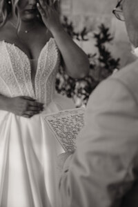 a black and white shot of a letter written to a father of the bride at chandelier farms