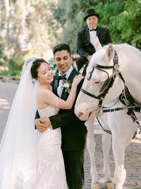 An unforgettable wedding moment surrounded by lush bougainvillea and golden light—captured with soft elegance by Los Angeles Top Destination Wedding Luxury Photographer Michael Asmussen. From Temecula Valley Wine Country to Tuscany, Italy this image embodies timeless beauty, couture bridal styling, and modern romance with a soulful lens.