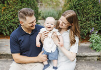 Parents and happy baby boy enjoying family photos in Toronto's Alexander Muir Memorial Gardens
